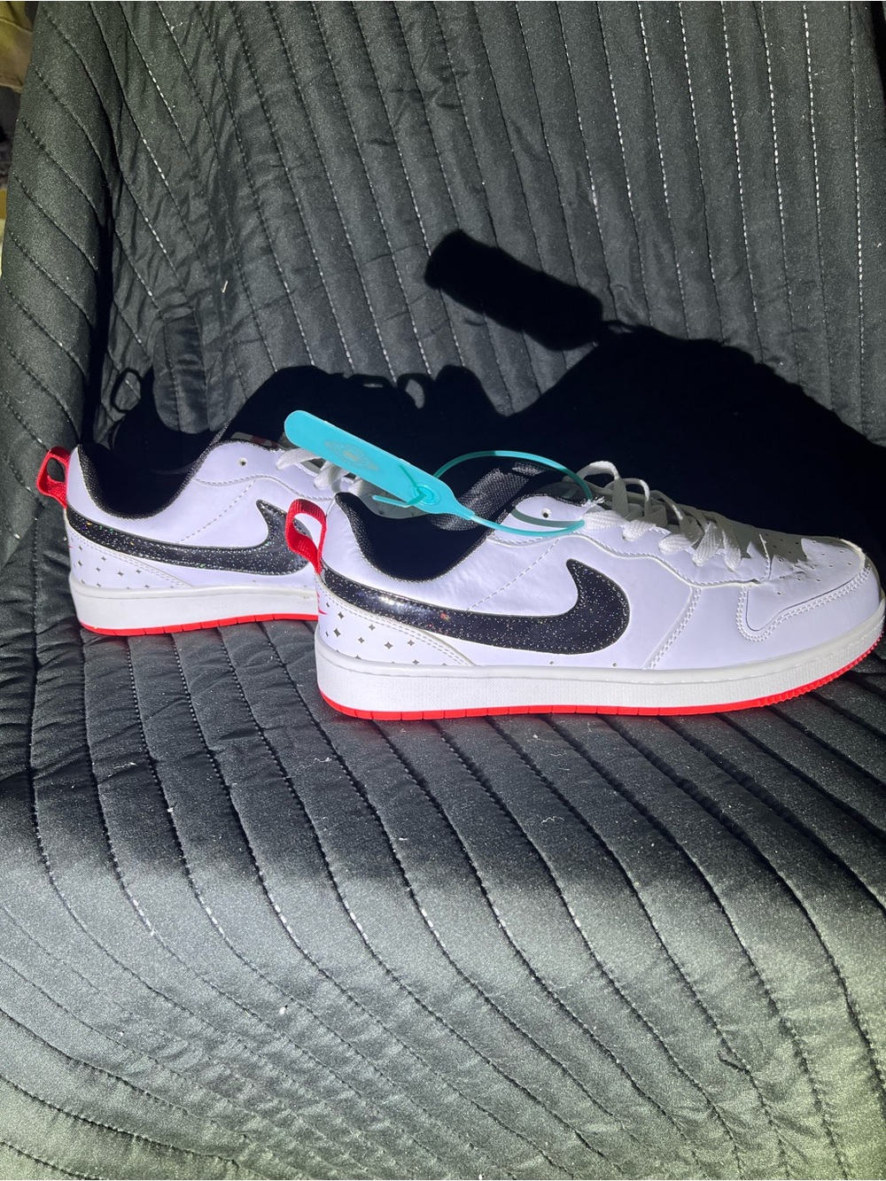 Nike White Low-Top Sneakers with Black Swoosh and Red Outsole - Picture 6 of 8